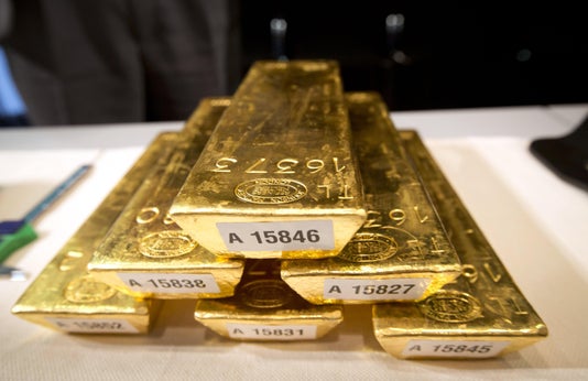 Bars of gold are piled up during a press conference at the German Federal Bank in Frankfurt am Main, Western Germany, on Jan. 16, 2013